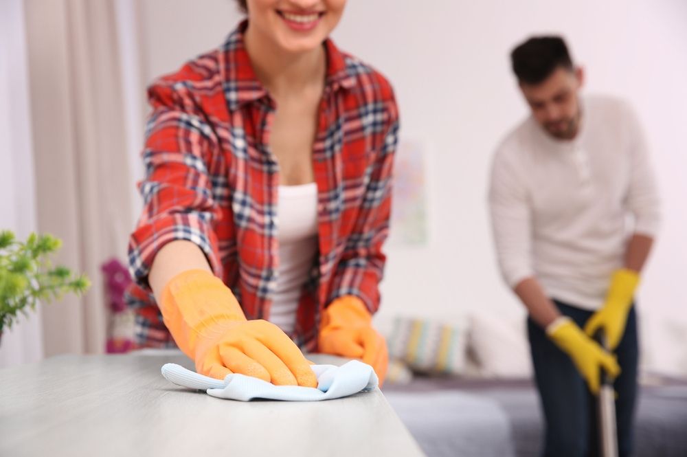 Couple cleaning their home together